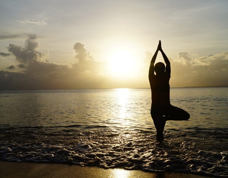 Beach yoga health wellbeing
